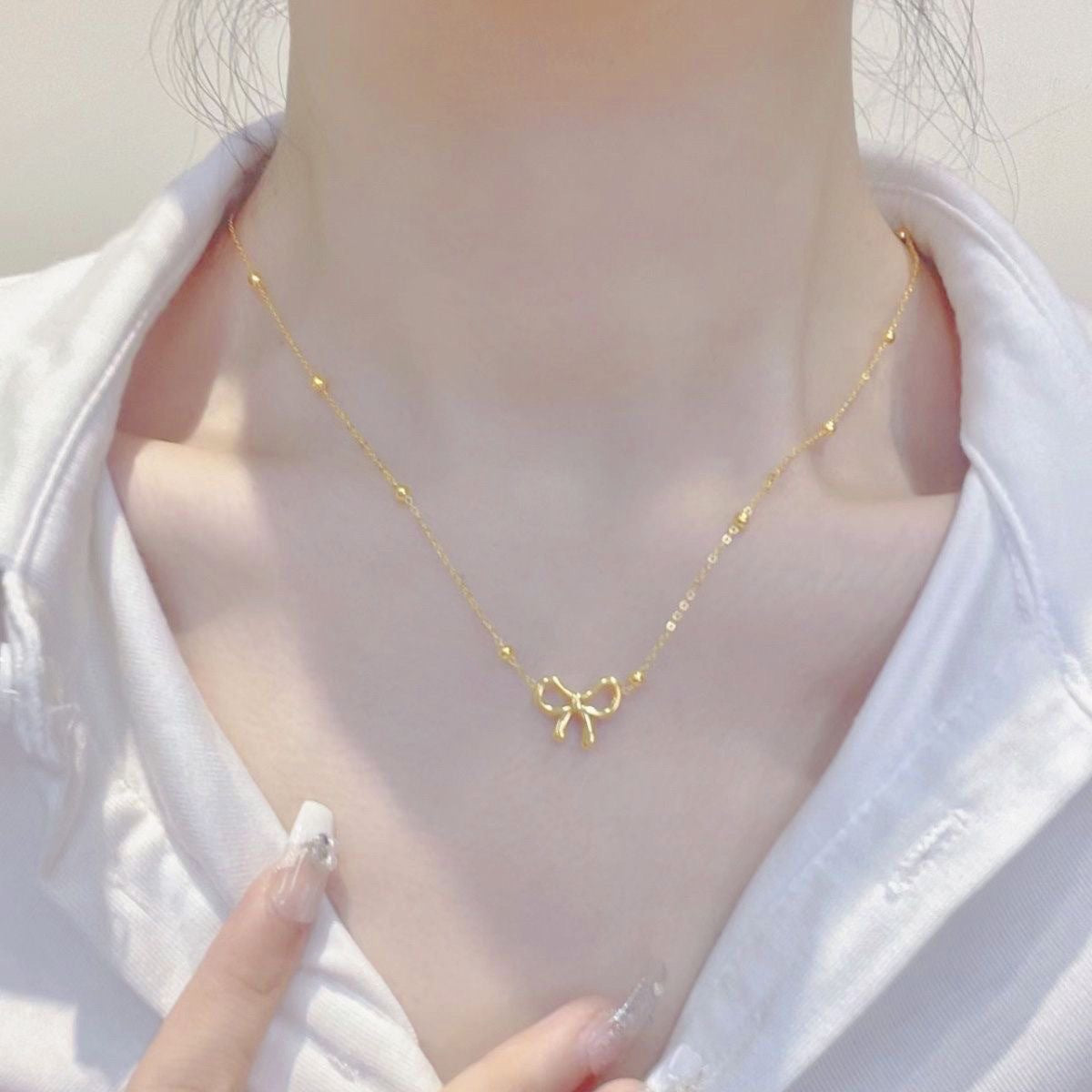 AMBASADOR Open-Bow Pendant Necklace