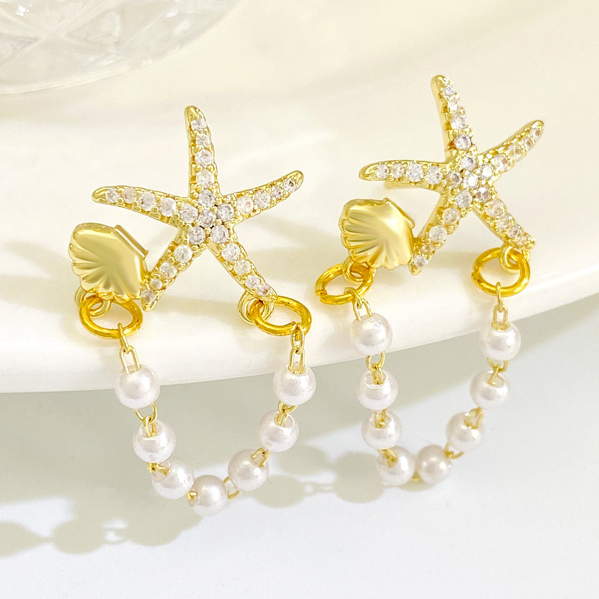 AMBASADOR Golden Starfish and Pearl Loop Earrings